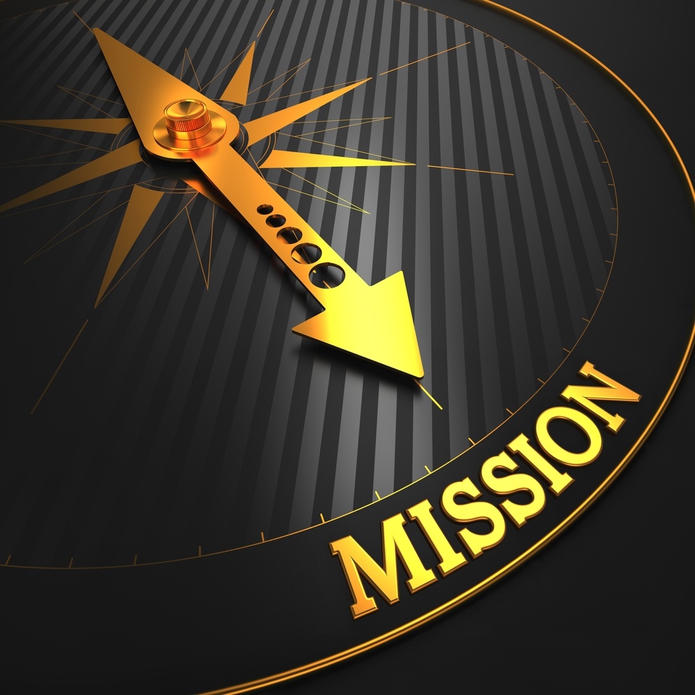 Mission - Business Concept. Golden Compass Needle on a Black Field Pointing to the Word Mission.